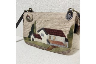 Double zippered wallet with house applique
