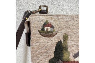 Double zippered wallet with house applique