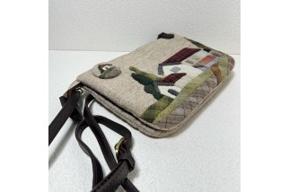 Double zippered wallet with house applique