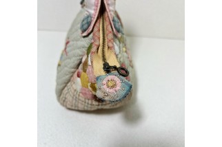 Hexagonal patchwork crossbody bag with appliqué