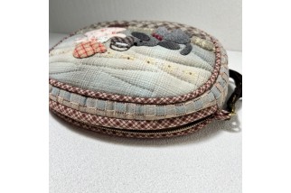 Adjustable shoulder bag with house applique