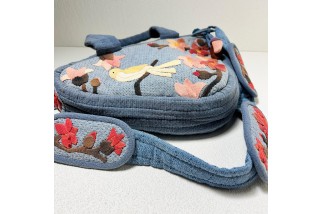 Triangle crossbody bag with bird and flower print